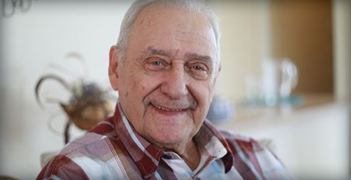 an elderly man smiling