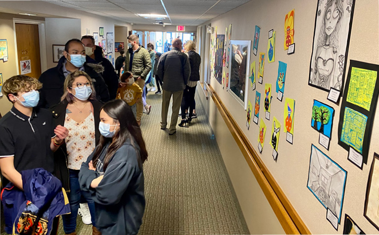 families gathered in the hallway