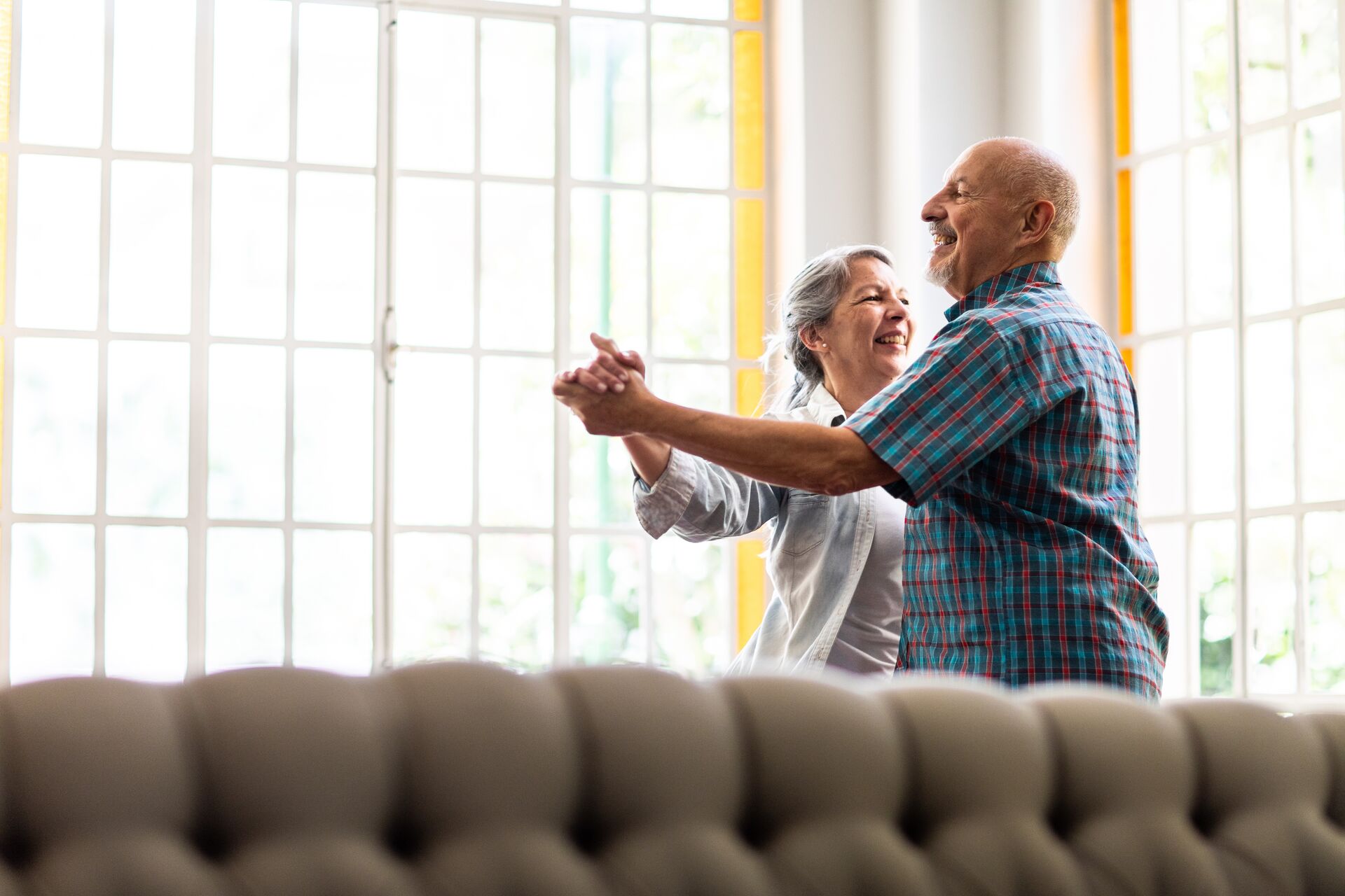 an elderly couple dancing