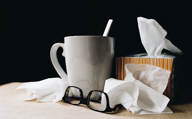 a coffee mug, tissue and glasses