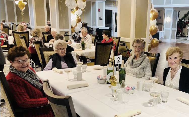 a group of elderly fakes in the dining room