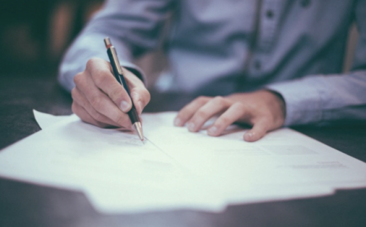 a man signing documents