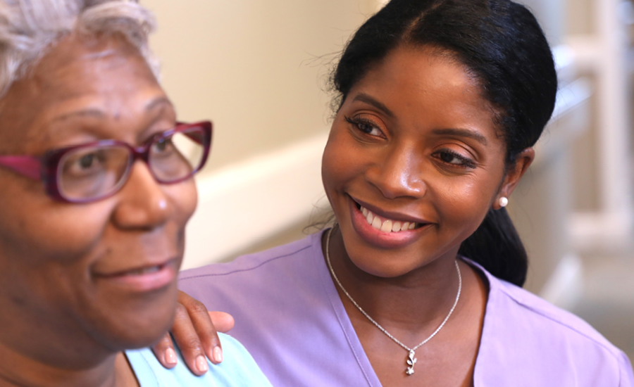 young female home healthcare woman discusses plan with senior woman