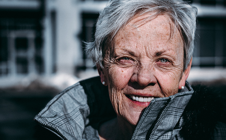 an elderly woman smiling