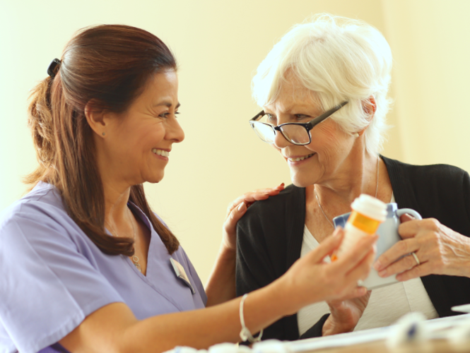 a female CNA helps female transition to home resident with medication