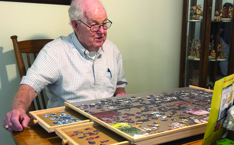 Al Bosma building a puzzle