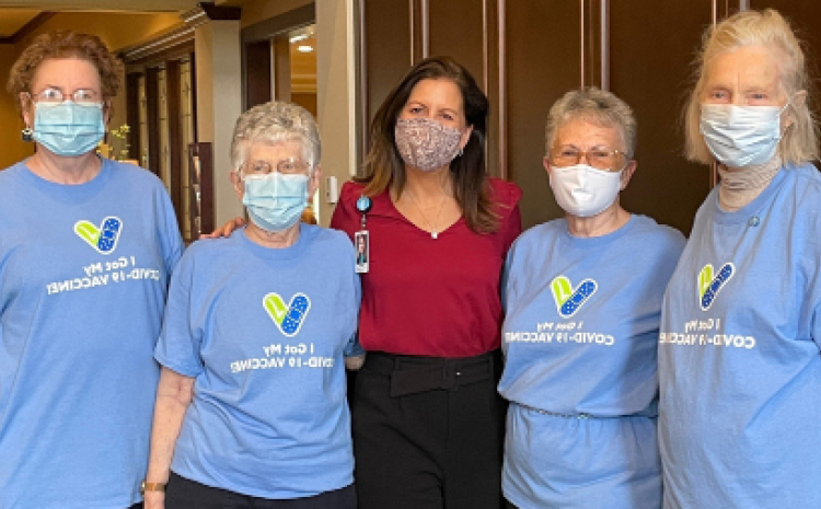 five ladies in surgical masks