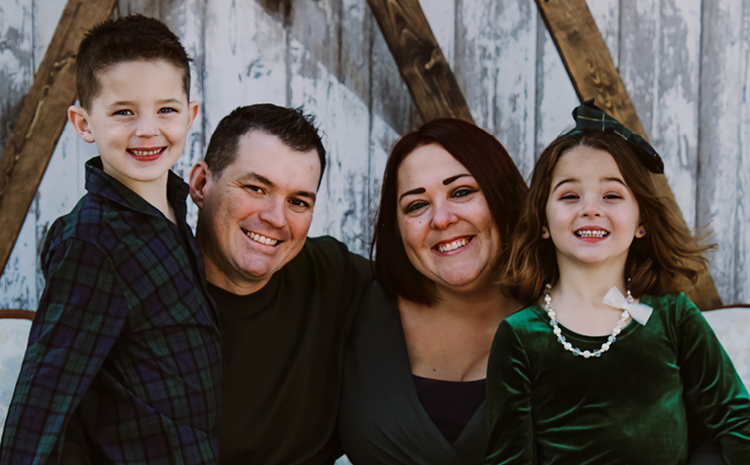 erin kelley and family smiling