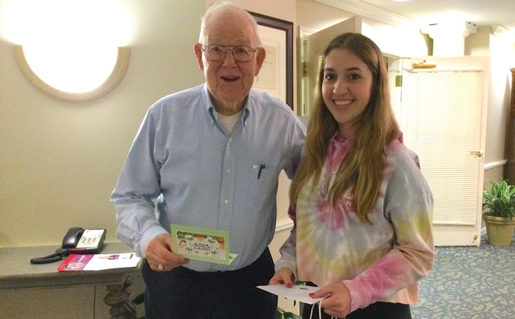 a woman and an elderly man smiling