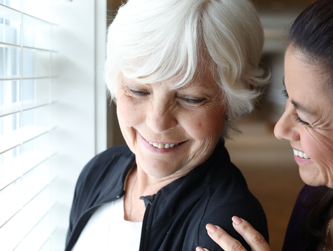 senior female resident tells female cna about her great experience at royal park place