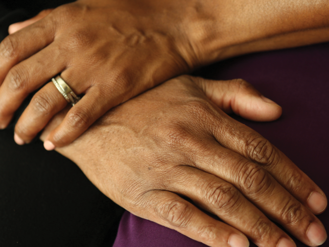 hand over hand comforting hospice patient