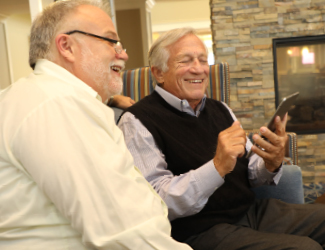 two senior men discuss independent living at park place st John