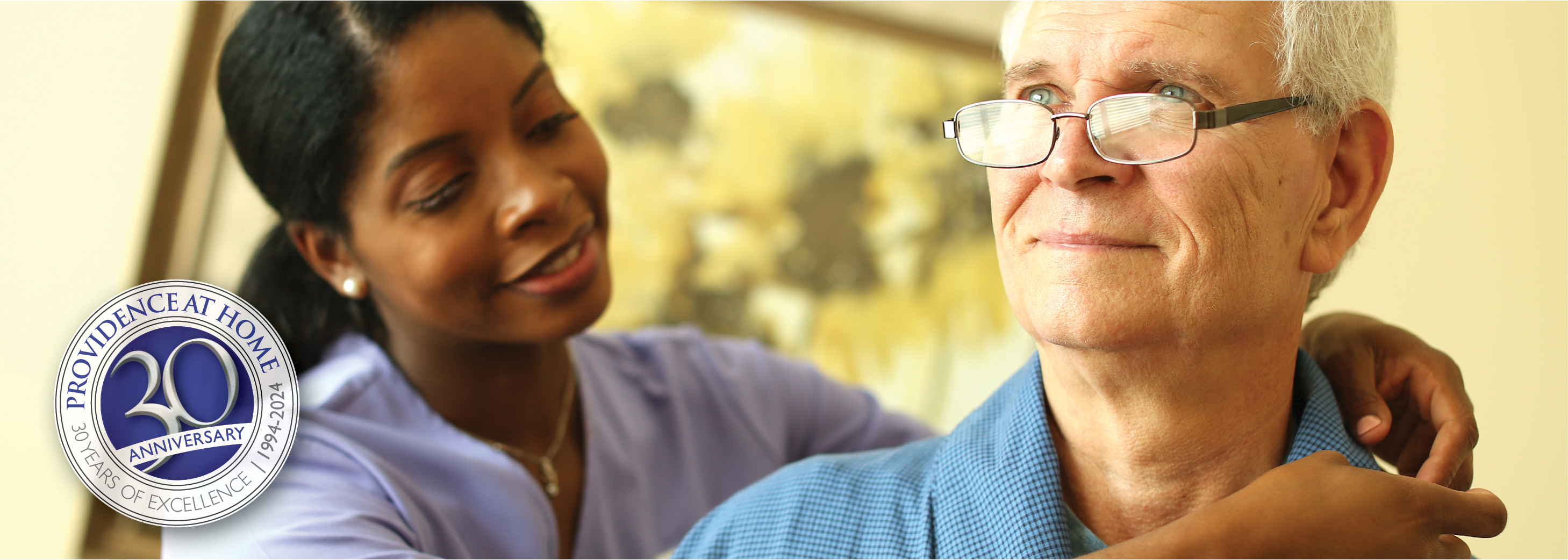 female healthcare staff assists senior man with shirt collar