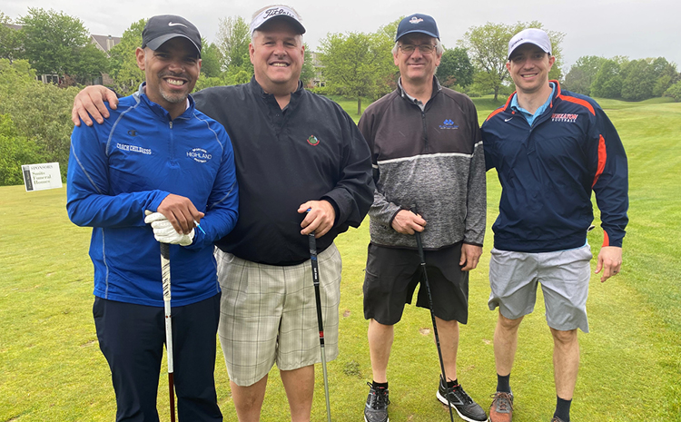 Four men golfing