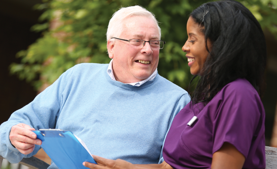 assisted living resident spends time with his cna