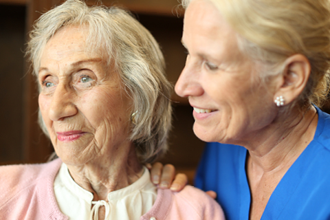 male therapist assists female rehab patient