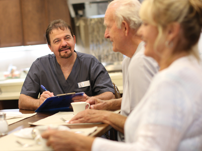 care partner assists during home residents