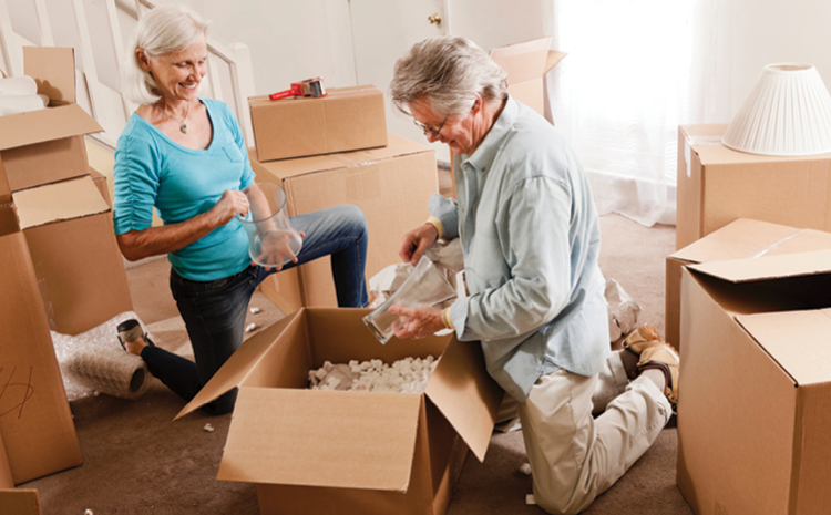 An elderly couple unboxing