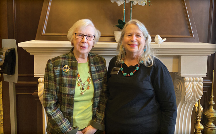 two elderly women smiling