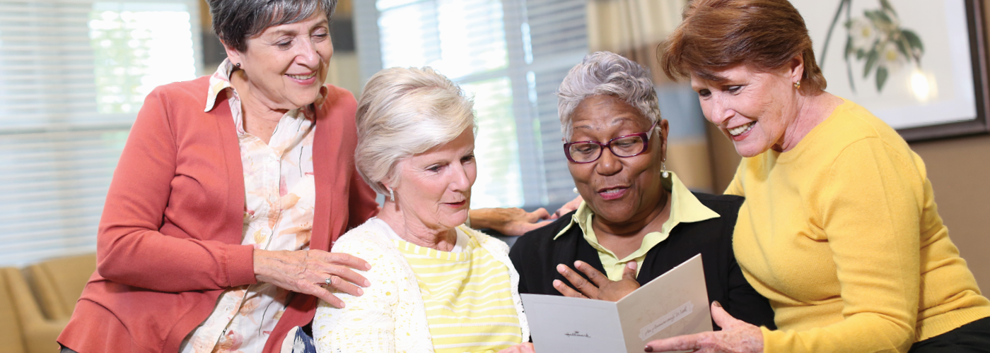 four senior women read together at providence independent living community