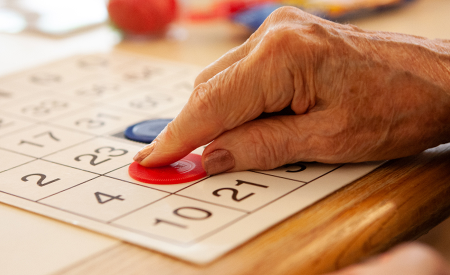 woman's hand shows playing bingo