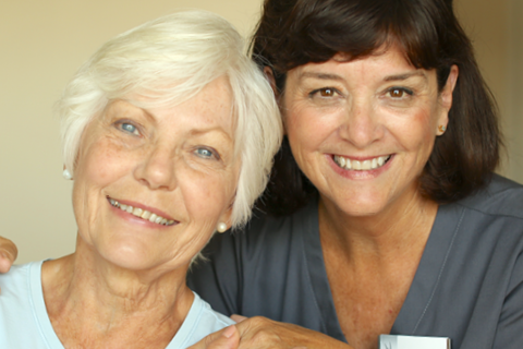 male therapist assists female rehab patient