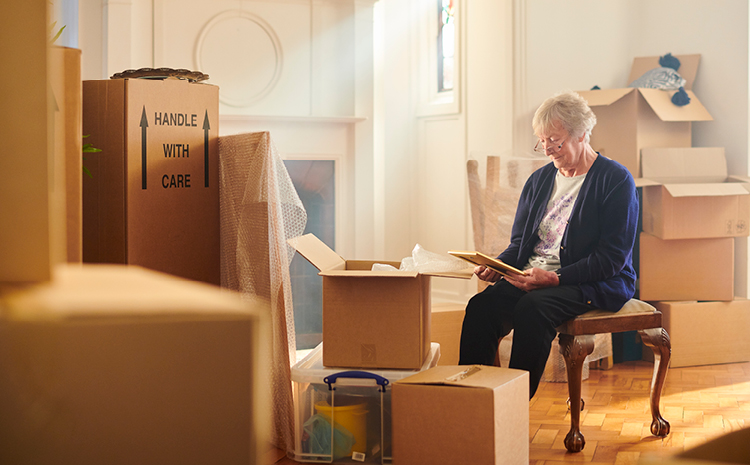 an elderly woman moving out