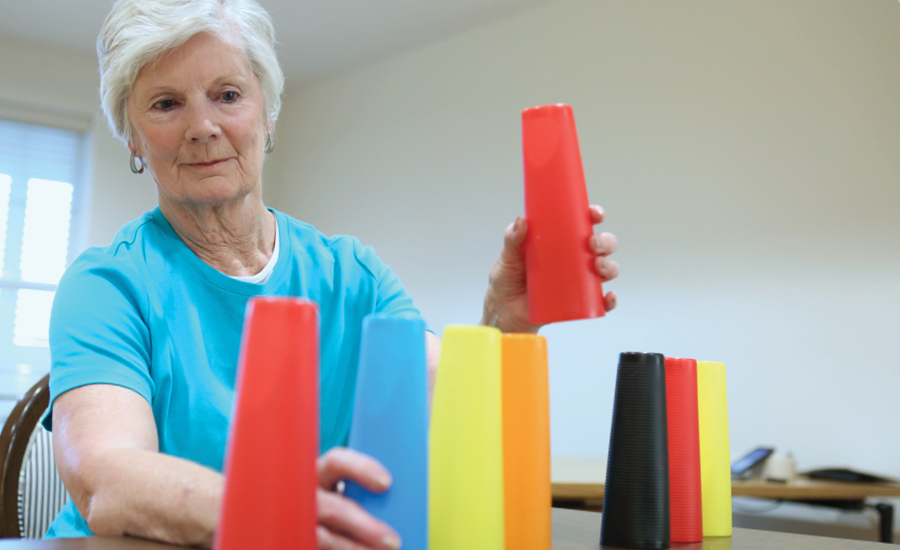 providence rehab patient moves cones for occupational therapy